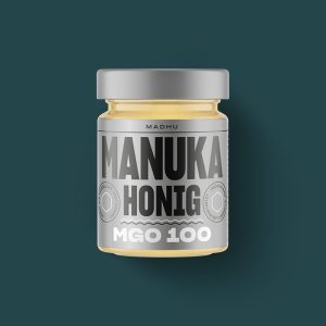 Abgebildet ist ein Manuka-Honig MGO100 in einem 250Gramm Glas.